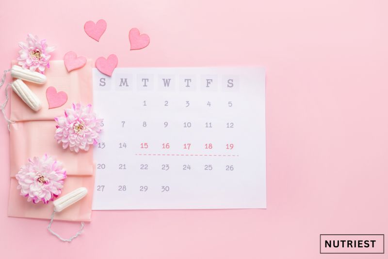 Pink menstrual cycle calendar, suggesting connection to anemia and periods.