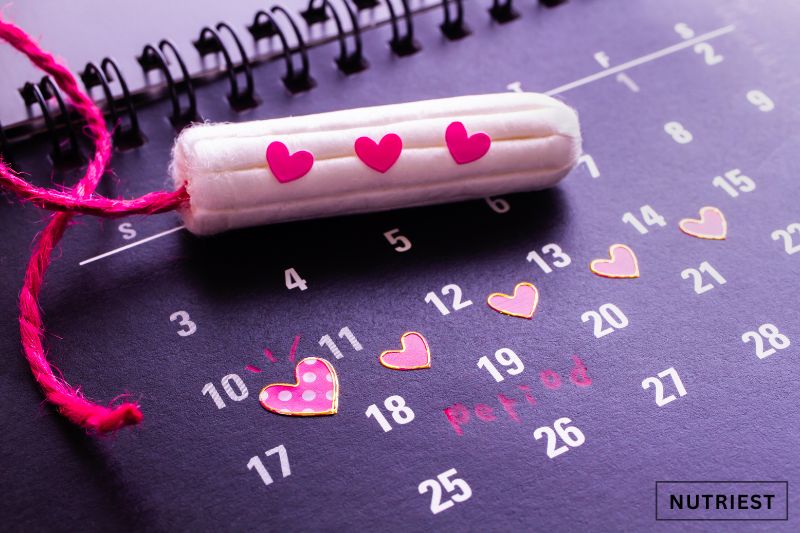 Tampon on calendar, suggesting menstruation and possible anemia connection