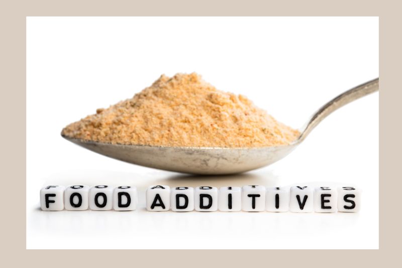 Food additives in a spoon